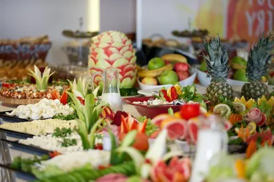a buffet of food with fruits and vegetables on a table at Grand Sagcanlar Hotel in Istanbul