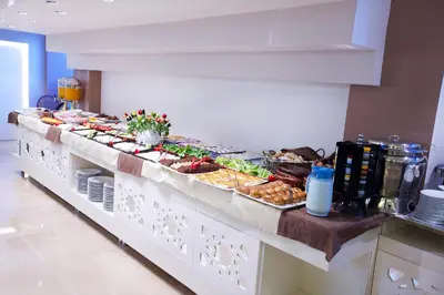 a buffet line with many different types of food at Grand Sagcanlar Hotel in Istanbul