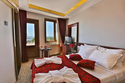 a hotel room with a bed with towels on it at Grand Sagcanlar Hotel in Istanbul