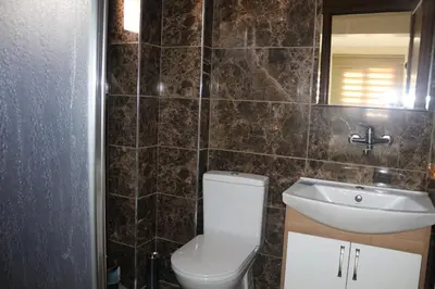 a bathroom with a toilet and a sink at Beyoglu Huzur Hotel in Istanbul