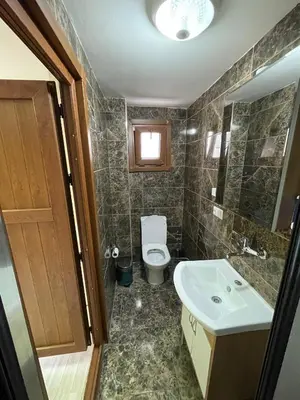 a bathroom with a toilet and a sink at Beyoglu Huzur Hotel in Istanbul