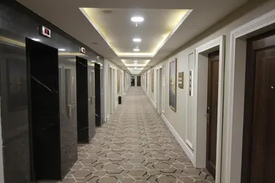 a hallway of a building with a tile floor at Ramada Plaza By Wyndham Sultanahmet in Istanbul
