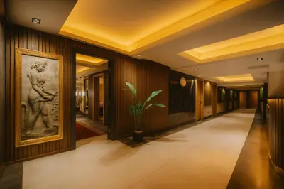 a hallway in a hotel with a painting on the wall at Ramada Plaza By Wyndham Sultanahmet in Istanbul