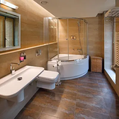 a bathroom with a tub and a toilet and a sink at Galateia Residence in Istanbul