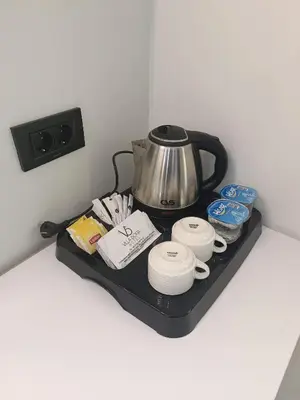a tea kettle and other items on a tray at Villa Sofia in Istanbul