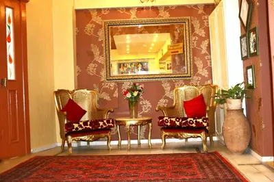 a room with chairs and a table and a mirror at Divas Hotel in Istanbul