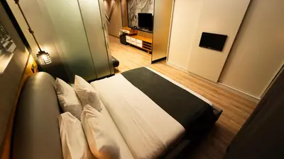 a bedroom with a bed in a room at Mas Suites Nisantasi in Istanbul