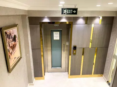 a elevator in a building with a sign above the door at Bursa Suites Apart Otel in Bursa