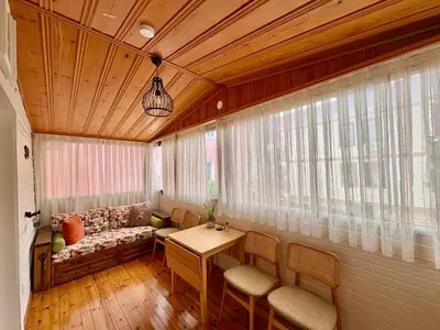 a living room with a couch and a table at Charming Anatolian House in Çengelköy in Istanbul