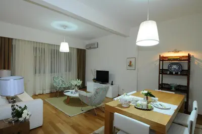 a living room with a table and a dining room at Cheya Taksim BNB Gumussuyu Istanbul City Center Comfort Residence in Istanbul