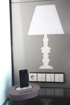 a laptop sitting on a table next to a lamp at Hotel La Villa in Istanbul