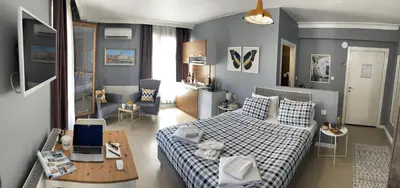 a bedroom with a bed and a living room at Flats Company - Karakoy Apartment in Istanbul