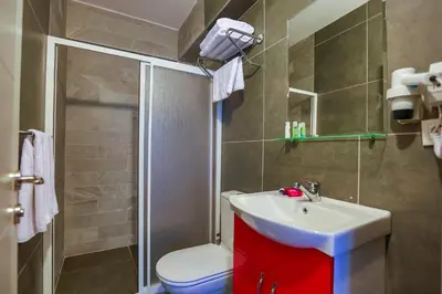 a bathroom with a toilet and a sink and a shower at Flats Company - Karakoy Apartment in Istanbul