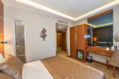 a bedroom with a bed and a bathroom at Glorious Hotel in Istanbul