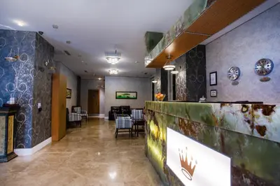 a lobby with a bar with a dining room in the background at Boutique Princess Hotel in Istanbul