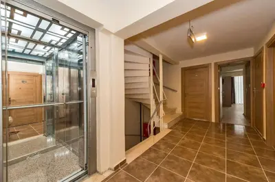 a hallway with a staircase and a glass door at Polanin Hotel in Istanbul