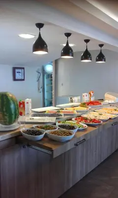 a buffet line with many bowls of food on display at Polanin Hotel in Istanbul