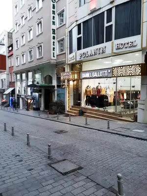 a city street with buildings and a street with shops at Polanin Hotel in Istanbul