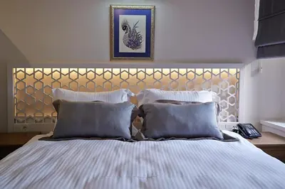 a bedroom with a large bed with two pillows at Arart Hotel in Istanbul