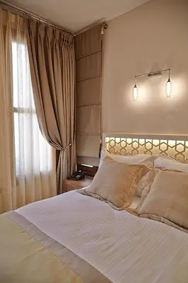 a bedroom with a large bed and a window at Arart Hotel in Istanbul