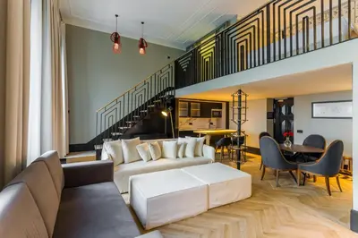 a living room with a couch and a table at The Wings Hotels Collection in Istanbul