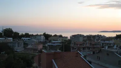 a view of a city at sunset at Sağlık Apart Pansiyon in Erdek