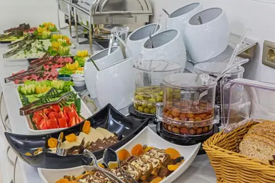 a buffet filled with different types of food on a table at Grand Naki Hotel in Istanbul