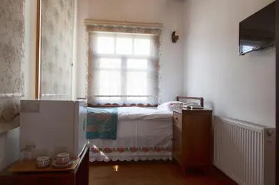 a bedroom with a bed and a window at Lal Hotel Bursa in Bursa
