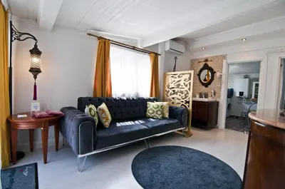 a living room with a couch and a table at Blue Mosque Suites-Old City Sultanahmet in Istanbul
