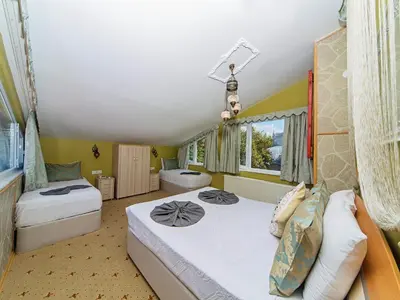 a bedroom with two beds and a window at Modern Sultan Hotel in Istanbul