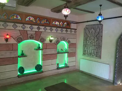 a room with green lights on the wall at Waha Hotel in Bursa
