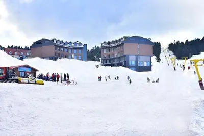 a group of people on a ski slope in the snow at Trendlife Hotels Uludağ ALL INCLUSIVE in Uludag