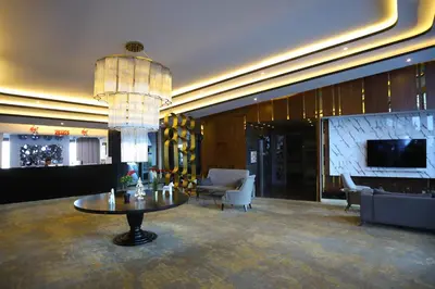 a large lobby with a table and a chandelier at Trendlife Hotels Uludağ ALL INCLUSIVE in Uludag