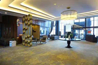 a lobby with a table and chairs in a building at Trendlife Hotels Uludağ ALL INCLUSIVE in Uludag