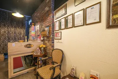 a room with a table and a chair and a wall at Loren Hotel&Suites in Istanbul