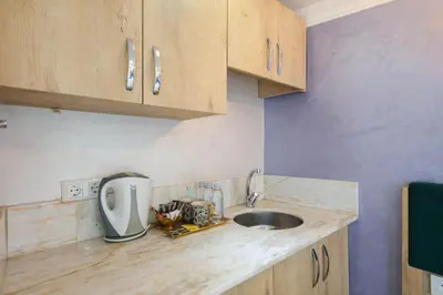 a kitchen with a sink and a counter top at Loren Hotel&Suites in Istanbul