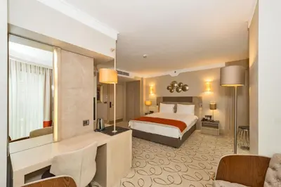 a hotel room with a bed and a desk at MARE PARK Hotel & SPA in Istanbul
