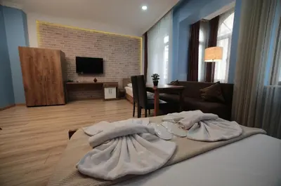 a bedroom with a bed and a living room at Taksim Park in Istanbul