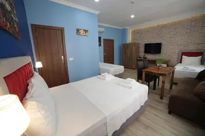 a hotel room with a bed and a couch at Taksim Park in Istanbul