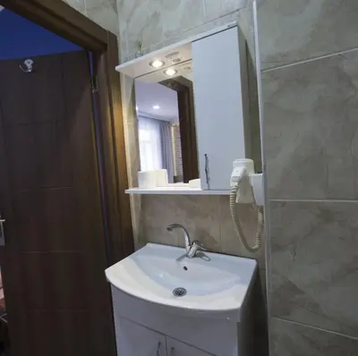 a bathroom with a sink and a mirror at Taksim Park in Istanbul