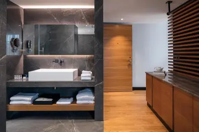a bathroom with a sink and a mirror at Metropolitan Hotels Bosphorus - Special Category in Istanbul