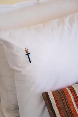 a small knife on top of a white pillow at Tiara Buyukada in Buyukada