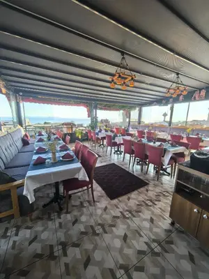 a restaurant with tables and chairs in a room at Apple Tree Hotel in Istanbul