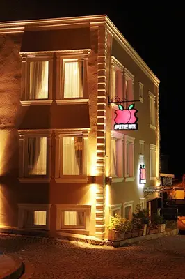 a building with a sign on the side of it at Apple Tree Hotel in Istanbul