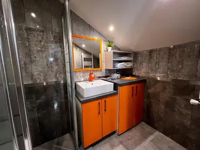 a bathroom with a sink and a shower at Zin D Home Otel Cekmeköy in Istanbul