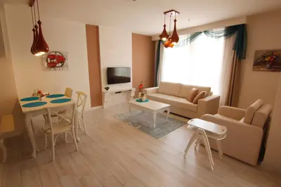 a living room with a couch and a table at Zin D Home Otel Cekmeköy in Istanbul
