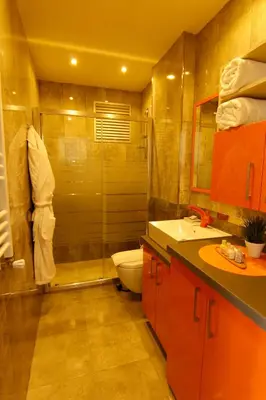 a bathroom with a shower and a toilet and a sink at Zin D Home Otel Cekmeköy in Istanbul
