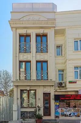 a tall building with windows and balconies on it at Ada Hotel Istanbul in Istanbul