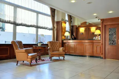 a waiting room with two chairs and a desk at Hotel Centrum Istanbul in Istanbul