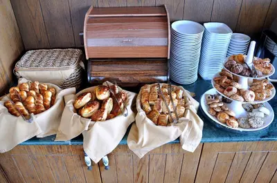 a table with several different types of pastries and plates at Hotel Centrum Istanbul in Istanbul
